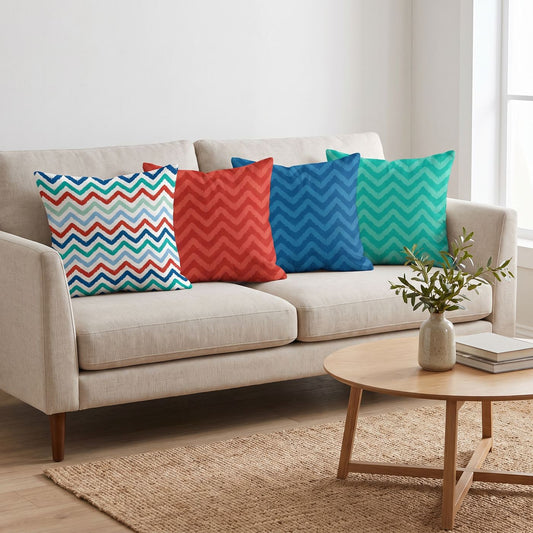 Chevron Trio — set of four printed cushions on a sofa — Karen Fabrics