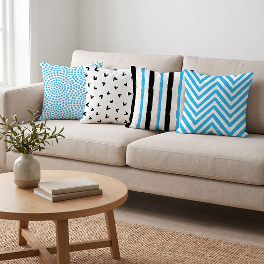Sky Blue Mix — set of four printed cushions on a sofa — Karen Fabrics