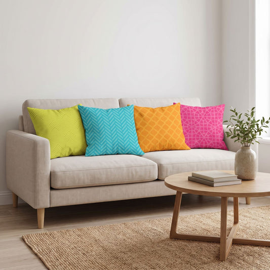 Citrus Pop — set of four printed cushions on a sofa — Karen Fabrics