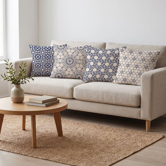Arabesque Navy — set of four printed cushions on a sofa — Karen Fabrics