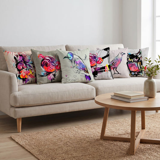 Painted Birds — set of six printed cushions on a sofa — Karen Fabrics