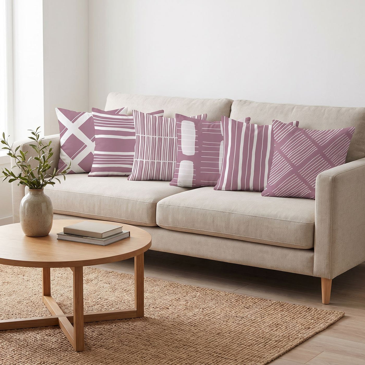 Mauve Lines — set of six printed cushions on a sofa — Karen Fabrics