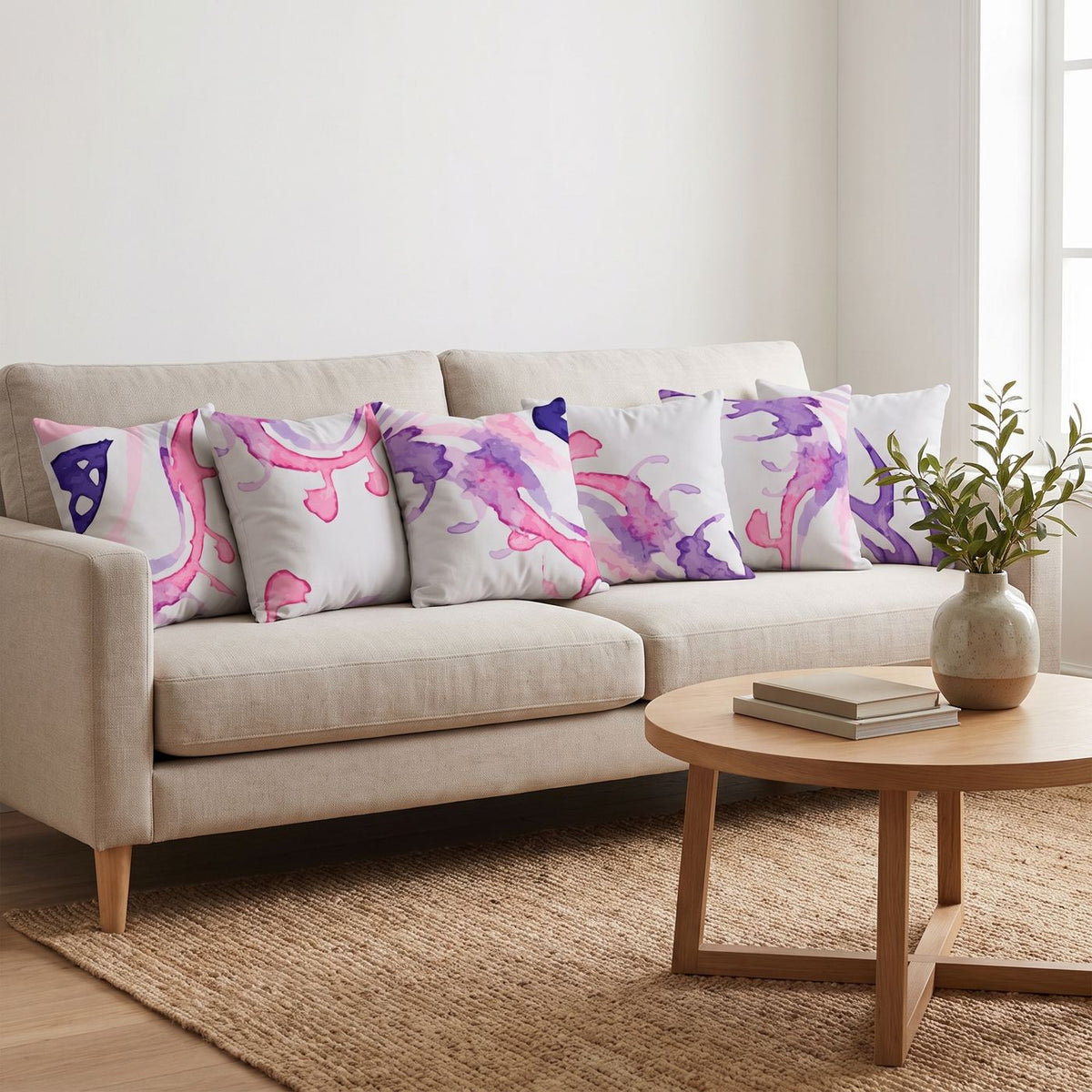Berry Splash — set of six printed cushions on a sofa — Karen Fabrics