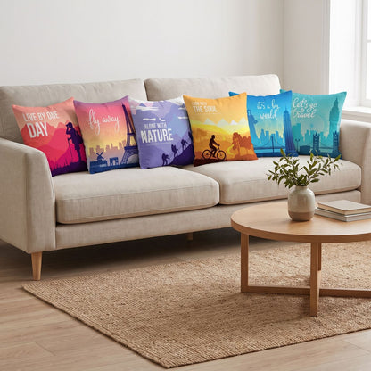 Travel Poster — set of six printed cushions on a sofa — Karen Fabrics