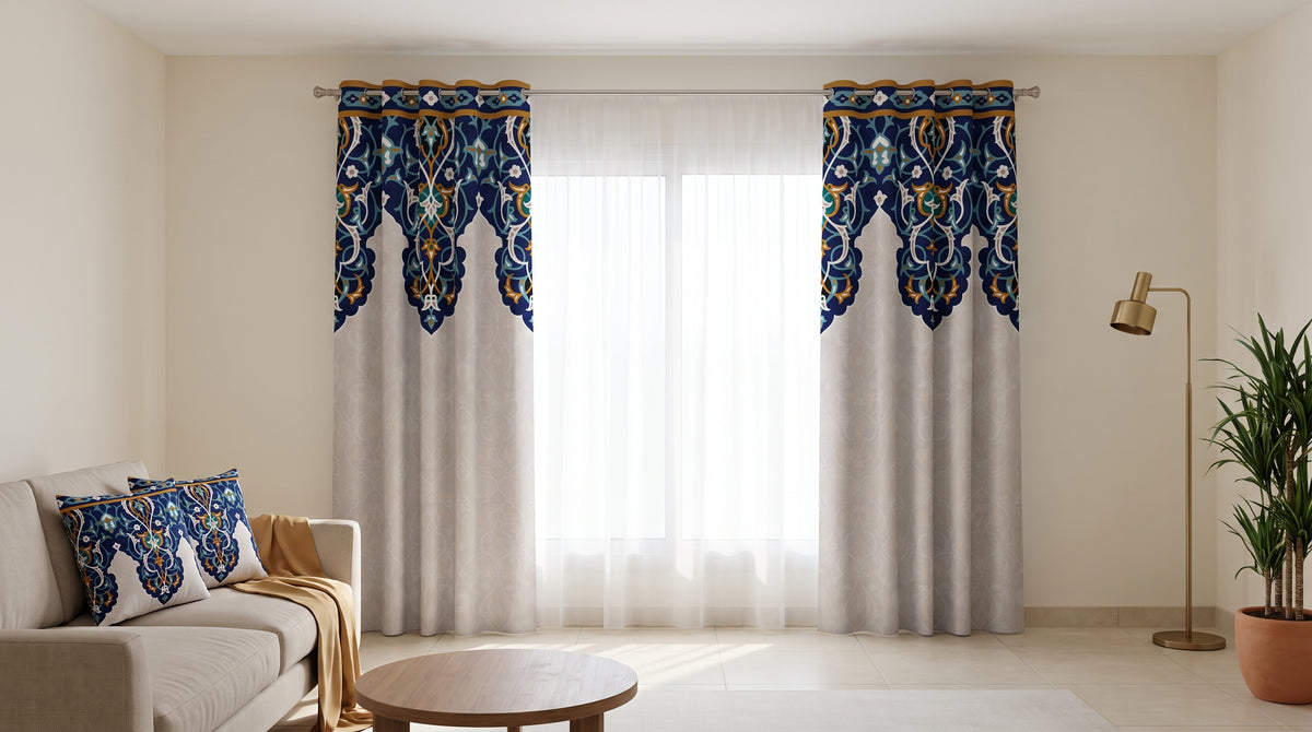 Printed curtains with a blue arabesque border in a bright living room, with matching cushions on the sofa